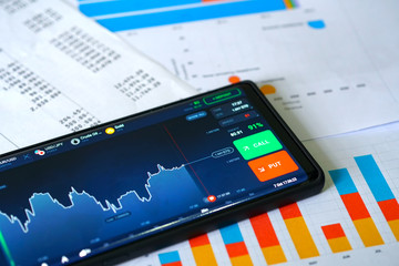 Business and Financial Concept. Online trading with chart display on smartphone with graph