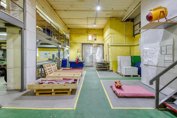 Interior of a small factory for the manufacture of electrical parts.