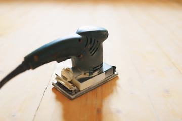 wooden floor sanding with flat sander tool