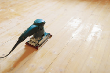 wooden floor sanding with flat sander tool