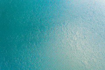 Fototapeta na wymiar Blue sea water texture calm and peaceful background top view
