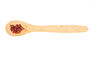 Dry red pepper in spoon