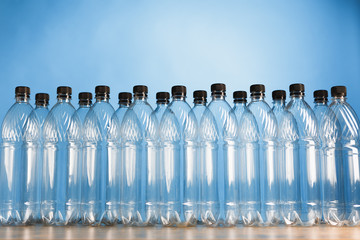 empty plastic bottles on blue background