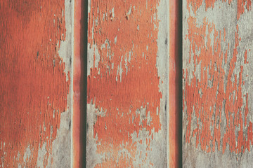 Red wooden background. Wooden background, painted surface of the old red boards. Weathered red wood texture close-up.  Vertical  planks.