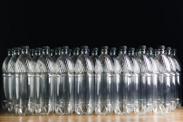 empty plastic bottles on black background