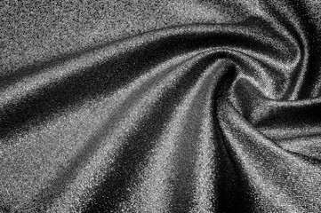 Fototapeta na wymiar Texture, background, pattern. Cloth Gray black coated with a metallic silver thread. These fabrics are ideal for any project, wallpaper, all design solutions. and many uses of ships.