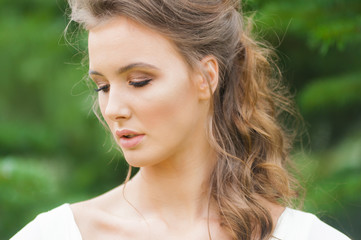 Fototapeta premium Portrait of beautiful bride with beautiful hairstyle and makeup
