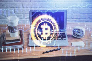 Multi exposure of blockchain theme hologram and table with computer background. Concept of bitcoin...