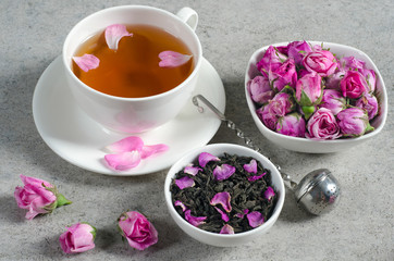 Cup of tea with rose petals.