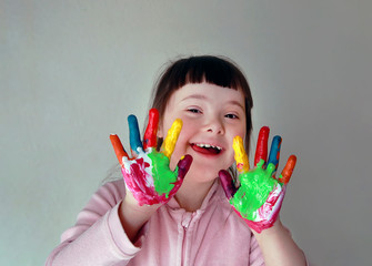 Cute little girl with painted hands. Isolated on grey background. - 294916721