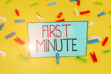 Text sign showing First Minute. Business photo showcasing promotional offers last within a very short amount of time Colored clothespin papers empty reminder yellow floor background office