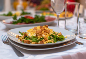 Banquet. Wedding. festive table setting. Snack. Interior, beautiful food. A plate of food. Fork wine glasses and juice.