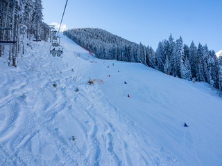 BANSKO, BULGARIA - January 2017 - Lift with tourist travel to snow top. Bansko is a ski resort in southwestern Bulgaria.