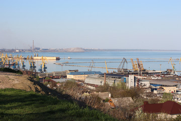 Seaport with large industrial cranes.