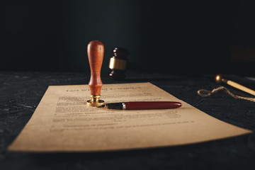 Notary's public pen and stamp on testament and last will. Notary public tools.