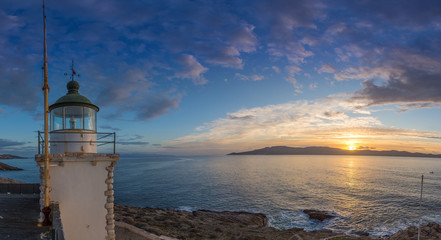 Fototapeta na wymiar Sunrise on Cape Vrysaki Lighthouse, Sounio Greece