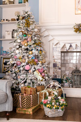 02.02.2019, Saint-Petersburg, Russia, beautiful modern design of the room in delicate light colors decorated with Christmas tree,decorative elements.interior design, magic atmosphere. pastel colors