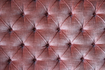 Fototapeta premium Close up of a red sofa texture