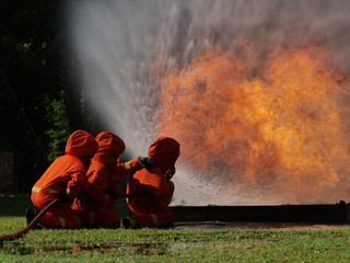 firefighter spray water to fire burning car workshop fire training