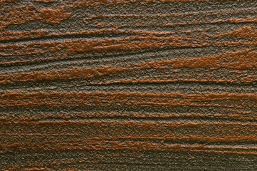 Rough texture of decorative plaster in brown tones.