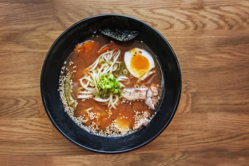 Ramen soup on the wooden table, top view
