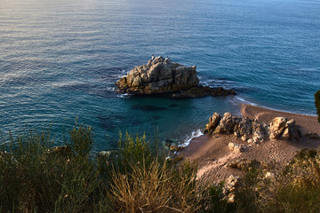 Fototapeta na wymiar Big rock in the blue sea