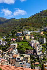 Obraz premium View of the houses in the Riomaggiore town. One of five famous centuries-old colorful villages of Cinque Terre National Park in Liguria, region of Italy.
