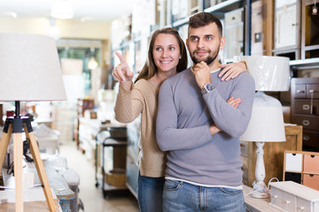 Couple in antique furnishings store