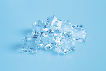 stack of ice cubes on blue