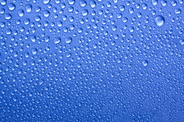 Dew droplets on coloured glass