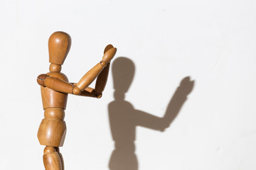 the articulated doll is happy and applauds