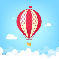 Obraz premium Vintage retro balloon with a basket flying in the sky. Vector illustration in cartoon flat style.