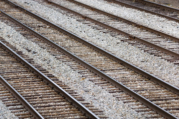Fototapeta premium Several Parallel Railroad Train Tracks In A Rail Yard