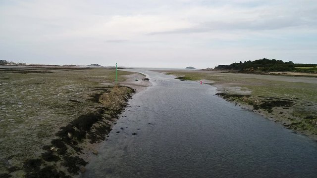 Aerial view. Channel fairway navigation marks during low tide in the town of Paimpol in Northern France, in Brittany.
