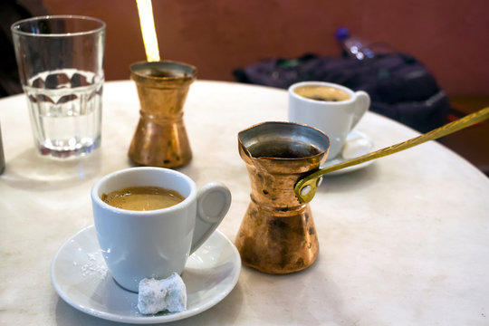 Copper coffee pots and greek coffe, sweet loukoumi on the small dish. Taken in Athens
