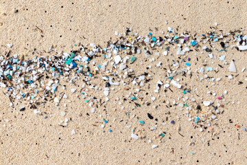 Fototapeta na wymiar Micro Plastics Washing Ashore On The Beach In Hawaii, USA