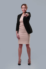 full length . young businesswoman pointing at you