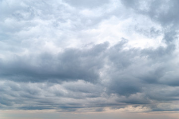Dark clouds. Sky with rainy gray clouds in the evening at sunset.
