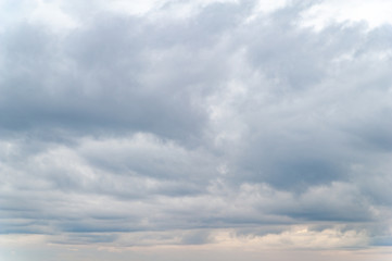 Dark clouds. Sky with a lot of gray clouds in the evening at sunset.
