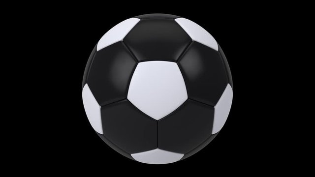 Realistic black and white soccer ball isolated on black background. 3d looping animation.