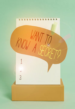 Writing note showing Want To Know A Secret Question. Business concept for to divulge a confidential vital information Spiral notepad box speech bubble arrow banners cool colored background