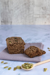 Gluten-free cereal bread with pumpkin seeds. Without flour, without yeast. Vertical orientation. Copy space.