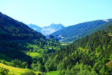 Naklejka na ściany i meble An unusually beautiful landscape of mountains in the vicinity of Soldeu. Andorra, June 29, 2019