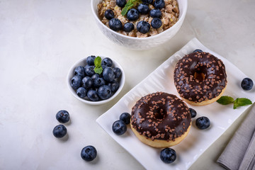 Breakfast with baking and berries on light background