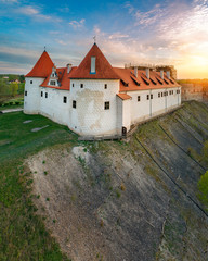 Naklejka premium Bauska town aerial panorama with Bauska medieval castle in sunset.