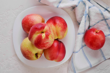 Naklejka na ściany i meble Ripe juicy nectarine with water drops.Fresh fruit nectarines healthy food.Vitamins are food for vegetarians.