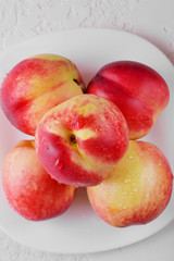 Ripe juicy nectarine with water drops.Fresh fruit nectarines healthy food.Vitamins are food for vegetarians.