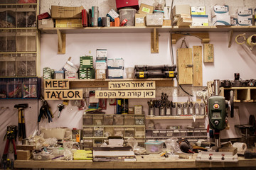 Various objects on wall and desk in workshop