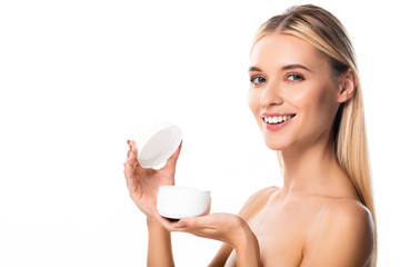 smiling naked woman holding cosmetic cream isolated on white