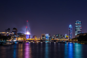 London Cityscape panorama at night, seen from Tower Bridge